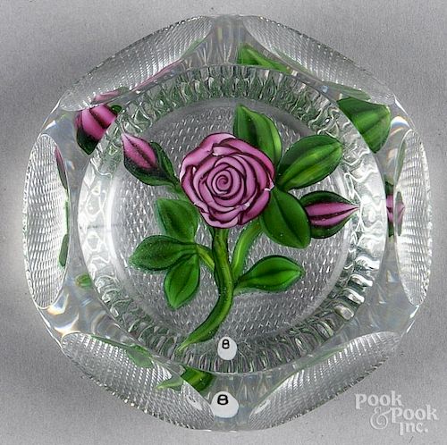 Ray Banford coiled red rose paperweight, with green leaves and two buds, faceted, with grid-cut base