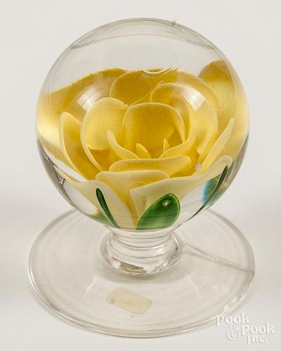Pairpoint yellow crimp rose pedestal paperweight, with a wide base, signed, 3 1/8'' dia. Provenance: