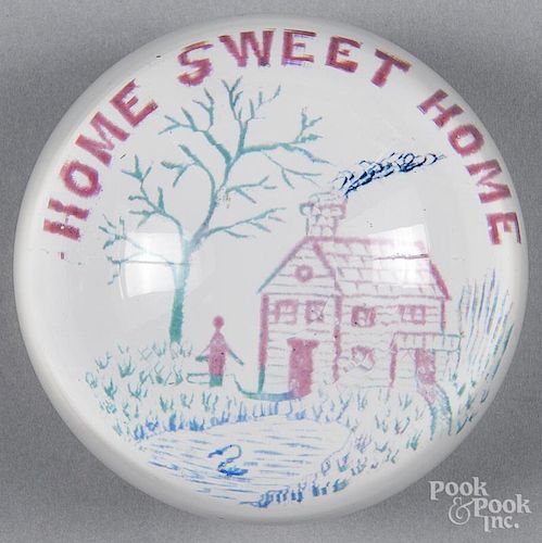 Multicolored Home Sweet Home frit paperweight on a white ground, 3 3/4'' dia.