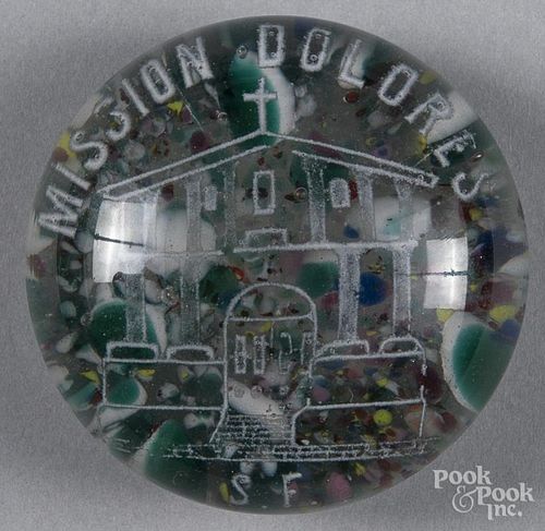 White frit souvenir paperweight, over a ground of colored chips, inscribed Mission Dolores, 3 1/4''