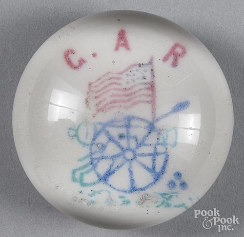 Colored frit paperweight on a white ground, labeled G. A. R., above an American Flag, 3 1/4'' dia.