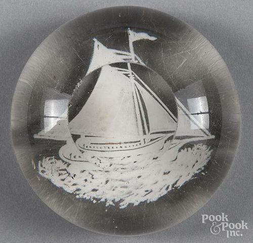 White frit paperweight, with a sailing sloop and top facet, 3 3/8'' dia.