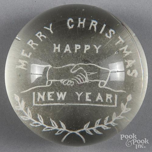 White frit paperweight, with a pair of clasped hands, inscribed Merry Christmas Happy New Year, 3
