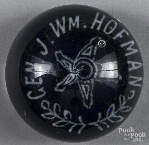 White frit paperweight, inscribed Gen. J. Wm. Hofman around a central star on a translucent cobalt