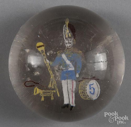 Colored frit paperweight, decorated with a drum major and instruments, 3 1/8'' dia.