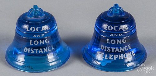 Pair of translucent blue glass bell advertising paperweights, inscribed Bell System New York Teleph