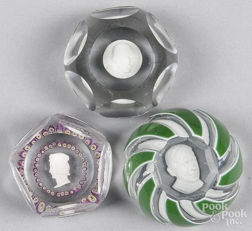 Three sulfide paperweights, to include a Baccarat green and white double overlay Will Rogers, with i