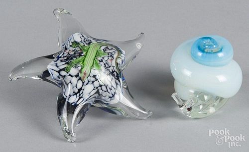 Two animal paperweights, to include a star shape with an internal lizard on a colored ground, 4 1/2''