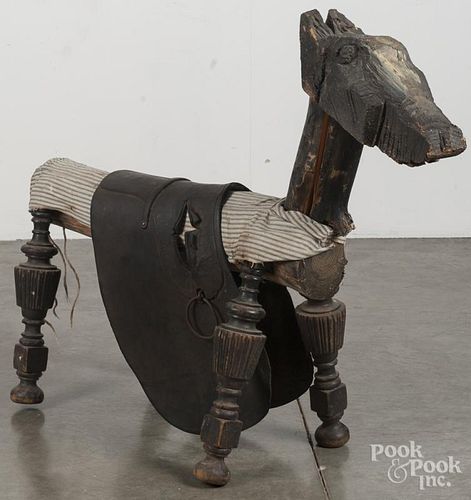 Primitive carved and painted horse, ca. 1900, 32'' h., 40'' l.