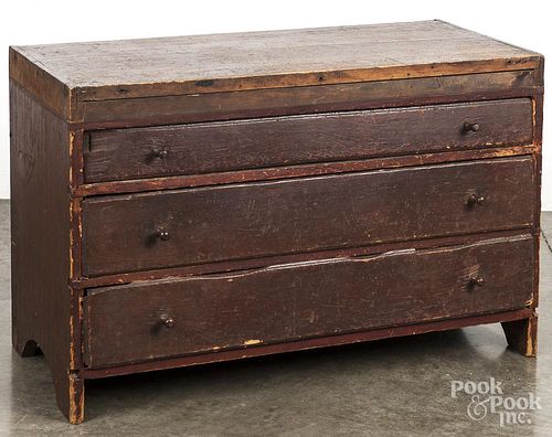 Primitive painted pine three - drawer stand, 19th c., retaining an old red surface, 22 1/2'' h., 35 1