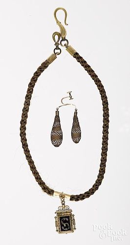 Victorian woven hair necklace with a locket pendant, 18'' l., together with a hairwork earring.