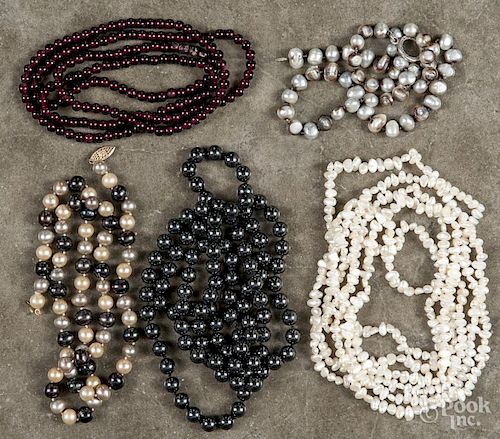 Six assorted beaded necklaces, to include four freshwater pearl necklaces, one with a 14K gold clasp