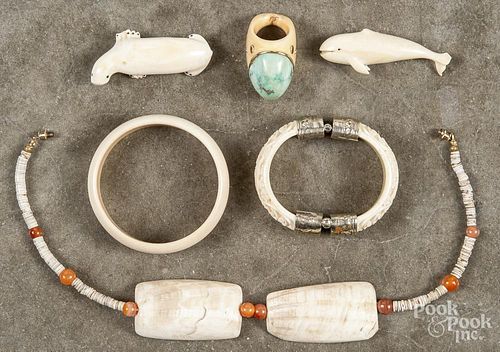 Assorted bone and ivory jewelry, to include bangle bracelets, a walrus and a whale pin, a beaded nec