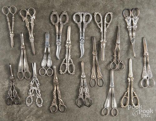 Collection of silver and plated grape shears.