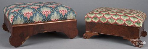 Two Empire mahogany needlepoint footstools, 19th c., 9'' h. and 7 1/2'' h.