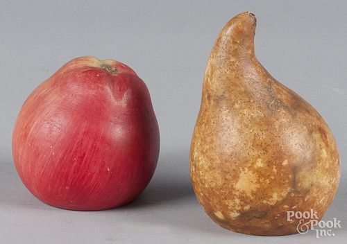 Carved and painted stone fruit bookends, ca. 1900, to include a pear and an apple, 5'' h.