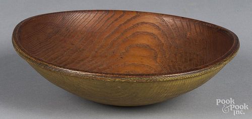 Turned and painted chestnut bowl 19th c., retaining an old yellow surface, 2 1/2'' h., 8 5/8'' w.