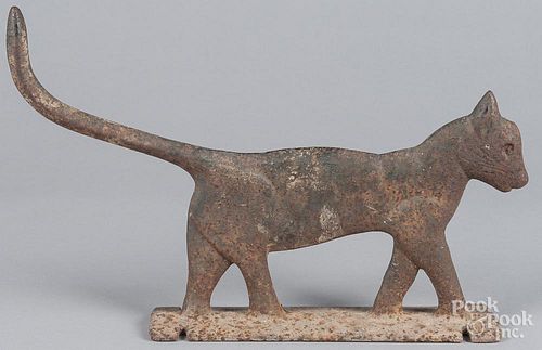 Cast iron cat doorstop or boot scrape, 19th c., mounted to an iron slab, 11'' h., 17'' l.