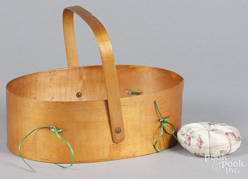 Sabbath Day Lake Shaker sewing basket, 19th c., with an attached strawberry pin cushion and another