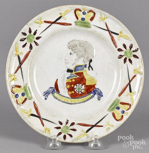 Pearlware plate, 19th c., with relief decoration of George IV, 7 3/8'' dia.