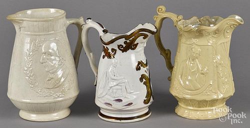 Three Ironstone and Staffordshire pitchers, 19th c., with relief portrait decoration, to include Wel