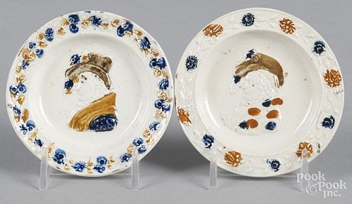 Two Pratt type pearlware cup plates, ca. 1800, with relief portrait busts, 3 1/4'' dia.