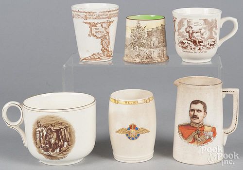 Six transfer decorated mugs and beakers of various subjects, to include Hector MacDonald, Commodore