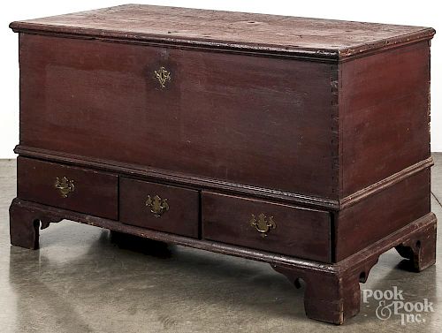Pennsylvania painted poplar dower chest, late 18th c., retaining a later red surface, 29'' h., 47'' w.