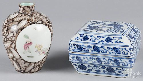 Chinese porcelain boy playing vase, 7'' h., together with a blue and white covered dish, 4 1/4'' h.