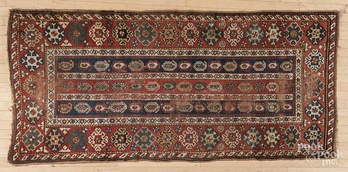 Kazak carpet, early 20th c., 7'9'' x 3'8''.