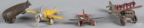 Three small cast iron airplanes, to include Hubley, largest - 4 1/4'' wingspan, together with a cast