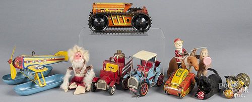 Collection of tin litho windup toys, to include a Marx tractor, Chein sea plane, Marx tank, Marx cat