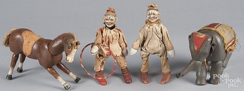 Four painted wood Schoenhut circus figures, to include two clowns, a glass eyed elephant and horse,
