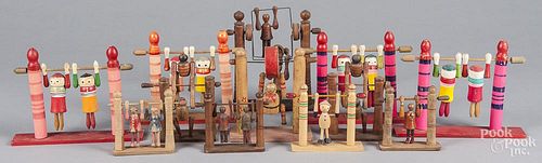 Collection of twelve carved and painted wood acrobat flip toys, early/mid 20thc., animated, includes