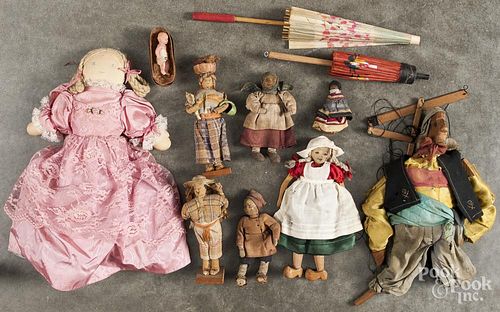 Group of miscellaneous dolls, to include a jointed wood example with printed fabric face, a topsy tu