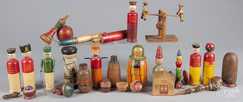 Collection of wooden toys, to include wooden soldiers, nesting dolls, dexterity games, etc. tallest
