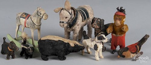 Group of miscellaneous toys, to include a wind-up skunk, a dog pull toy, a stick leg rocking horse,