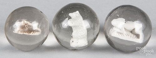 Three sulfide marbles, to include two running rabbits, and a standing bear, 1 1/2'' dia.