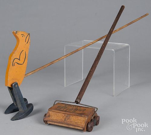 Unusual painted wood meerkat push toy, together with a child's Bissell sweeper, 27 1/2'' h.
