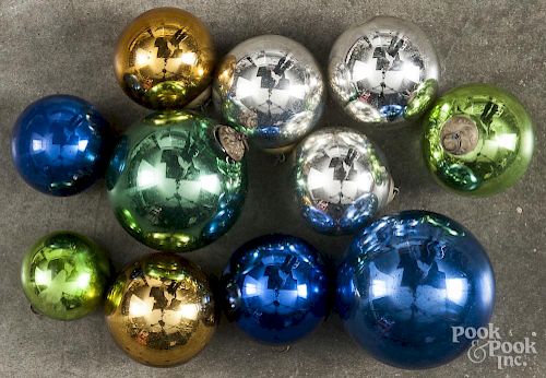 Group of eleven glass kugel Christmas ornaments with embossed caps, largest - 2 1/2'' dia.