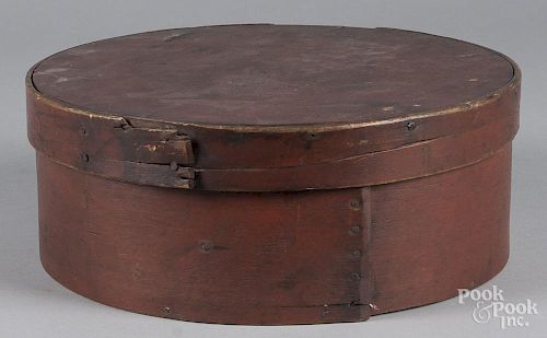 Painted bentwood box, 19th c., retaining its original red surface, 5 1/4'' h., 14'' w.