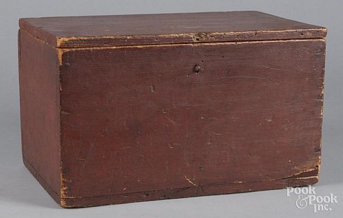 Painted pine lock box, 19th c., retaining its original red surface, 11'' h., 18 3/4'' w.