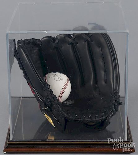 Curt Schilling signed baseball, with glove and display case.