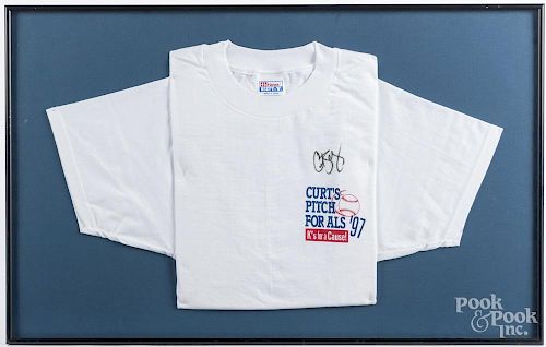 Pair of framed t-shirts listing Curt Schilling's 319 strike outs, one signed.