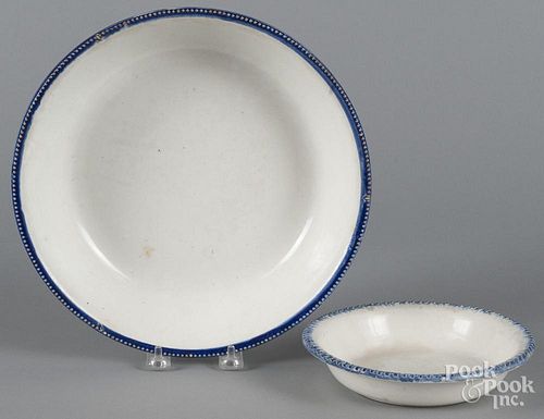 Two pearlware blue feather edge bowls, 19th c., 2 1/2'' h., 10 3/4'' dia. and 1 1/2'' h., 7'' w.