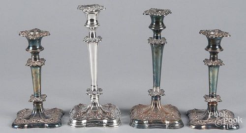 Two pairs of Sheffield plate candlesticks, 19th c., 10 1/4'' h. and 8 1/2'' h.