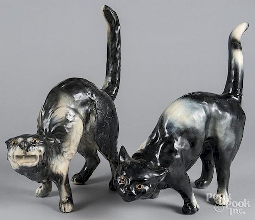 Pair of painted pottery roof cats, with glass eyes, 16'' h. and 17 1/2'' h.