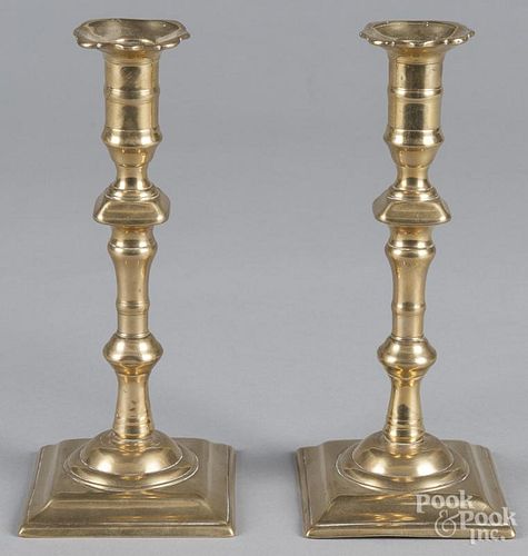 Pair of English Queen Anne brass candlesticks, 18th c., 8 1/2'' h.
