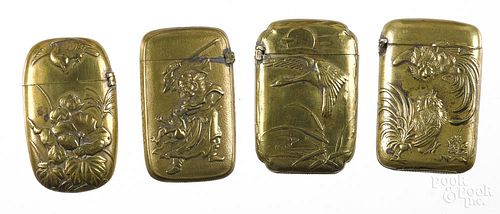 Four small Japanese embossed brass match vesta safes, one with fighting roosters, one with flowers,