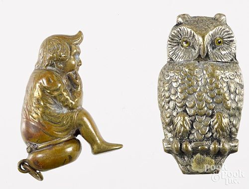 Two figural match vesta safes, to include a brass gnome sitting on a chamber pot, 2'' h., and a nicke